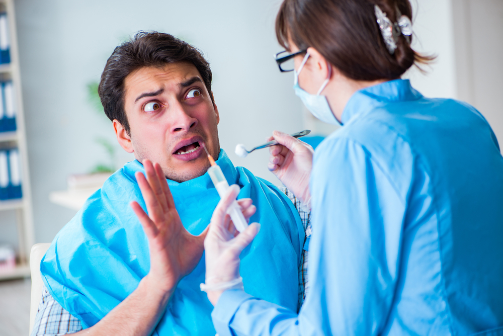 Patient afraid of dentist during doctor visit