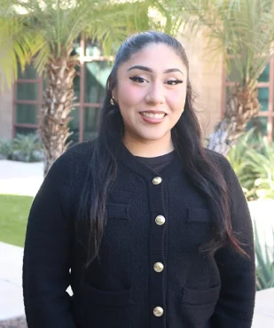 Diana smiling in a professional outdoor portrait