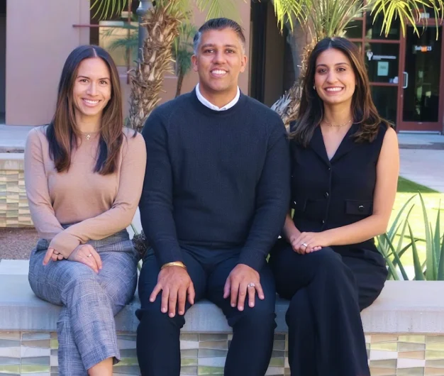 Dental team members posing together for a group photo