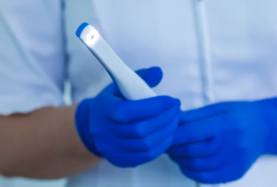 Dentist using an intraoral camera for dental imaging